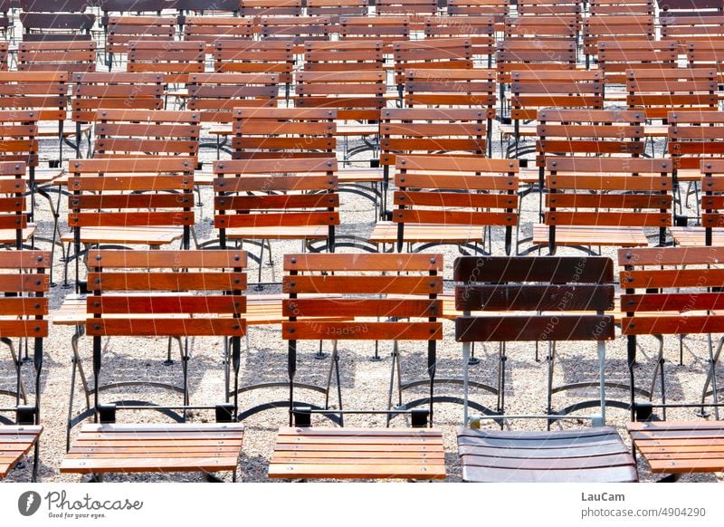 Someone always steps out of line chairs Chair rows in rank and file stand out stick out Arrangement Row Many many chairs Structures and shapes Deserted Seating