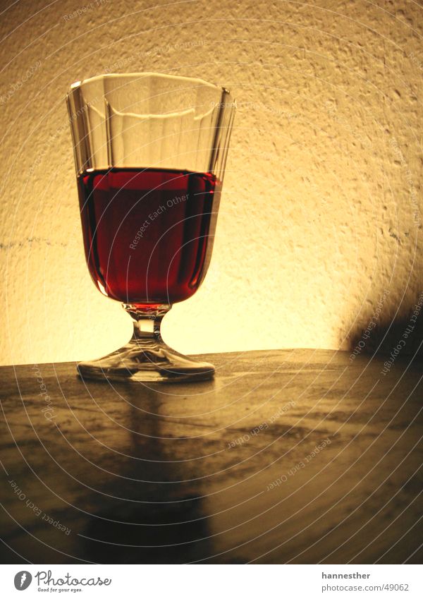 glaswein-wine-glass Red wine Delicious Wall (building) Table Light Dark Yellow Glass get drunk Table edge Wine Tabletop