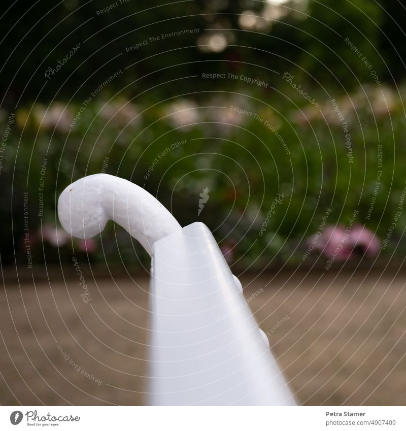 Squiggles from a white park bench Curlicue Park bench White squiggled Bench Break Relaxation Nature Calm Green Sit Exterior shot Deserted Garden