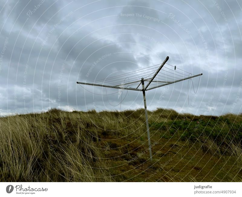 Rotary clothes dryer in the dunes duene Marram grass coast North Sea North Sea coast Jutland Denmark Sky Clouds Ocean Landscape Nature Vacation & Travel