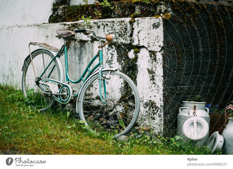 Old Rarity Bicycle Parked Next To Old Wall In Village aged beautiful bicycle bike city female nobody old out-of-date outdated outdoor outmoded rarity retro