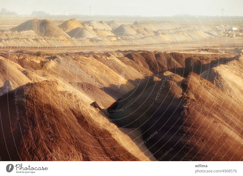 Spoil heaps, bizarre landscape in open pit mine Slagheap Stockpiles open pit mining dismantle extraction area opencast lignite mining Energy source coal mine