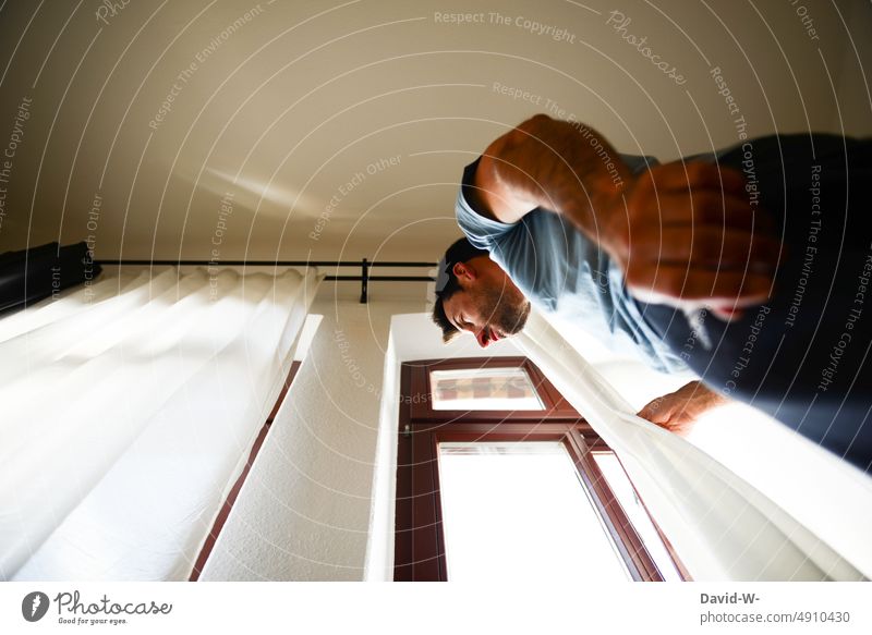 Man curiously looking out the window View from the window Window Observe garden Drape View from a window Curtain Window pane Light peep Flat (apartment)