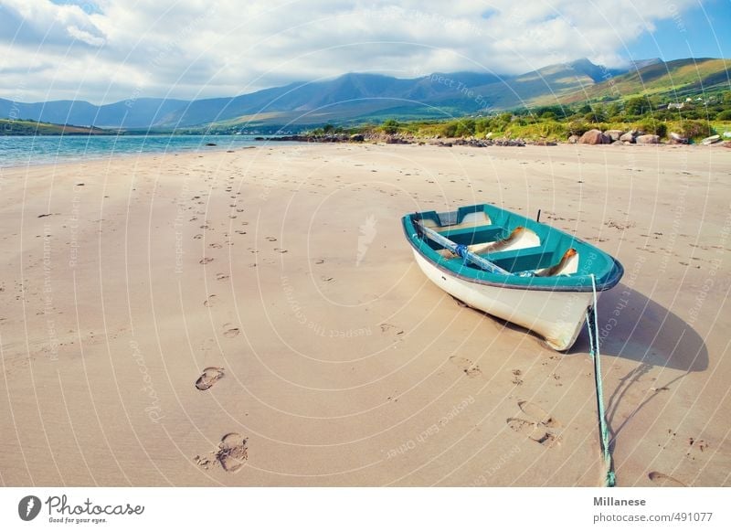 boat by the sea Landscape Coast Ocean Longing Watercraft Ireland Sandy beach Low tide Stranded Blue Mountain Colour photo Exterior shot