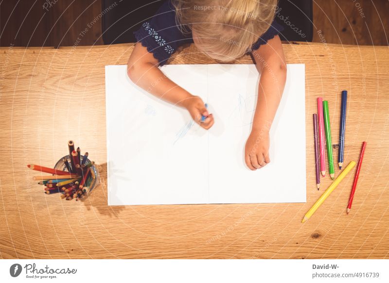boy coloring with crayons