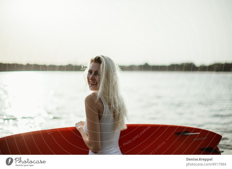 Woman with surfboard Face of a woman Woman's leg Girl power Idyll relaxed tranquillity relaxation Relaxation Summer free time holidays Joy Lifestyle pose Happy