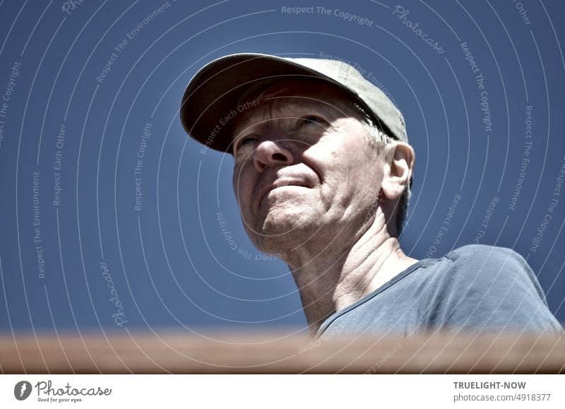 Way and goal front sky, concentrated and of - eye Man face, with t-shirt, in Stock in baseball cap shot portrait, shadow Free blue blue-grey view: a on Royalty cloudless sunlight under