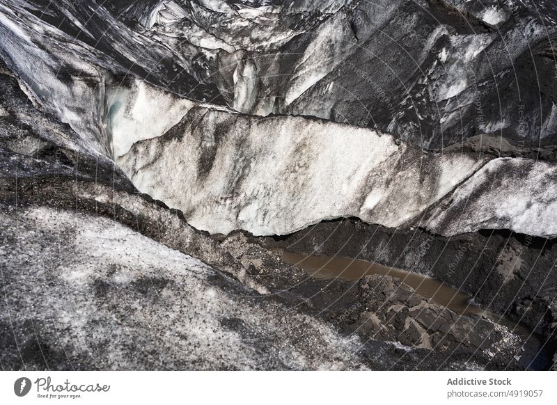 Massive glacier covered with ash in volcanic mountainous terrain landscape picturesque scenery nature winter formation ice scenic geology iceland rough volcano