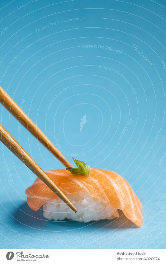 Norwegian nigiri with salmon and wasabi japanese norwegian chopstick sushi asian food seafood fish rice traditional slice utensil flavor ingredient light