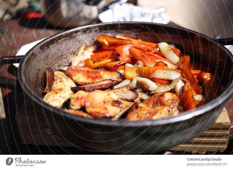 Pan with fried chicken and vegetables chicken meat cooking pan grilled food meal sauce fresh closeup spicy tasty wooden roast dish dinner healthy cuisine lunch