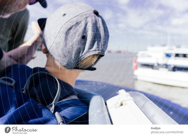 Man showing child something on horizon during boat ride Trip Boating trip Child Indicate look Infancy Exterior shot from behind unfamiliar Colour photo