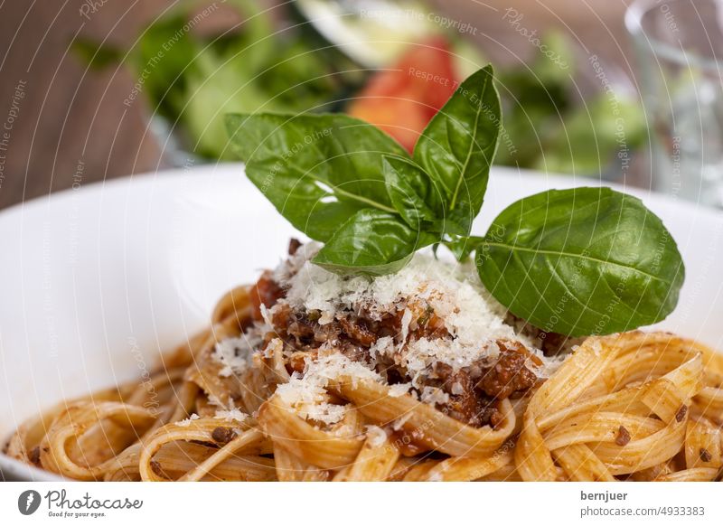 Tagliatelli pasta with bolognaise sauce on wood Tagliatelle Bolognaise sauce background Eating Parmesan Delicious salubriously tribunal Close-up traditionally