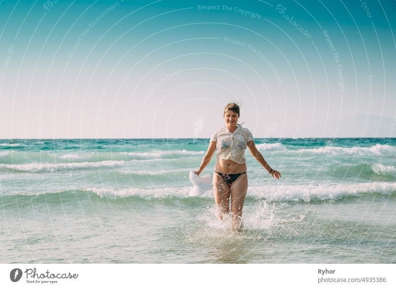 Woman stands in swimsuit beach concept Royalty Free Vector