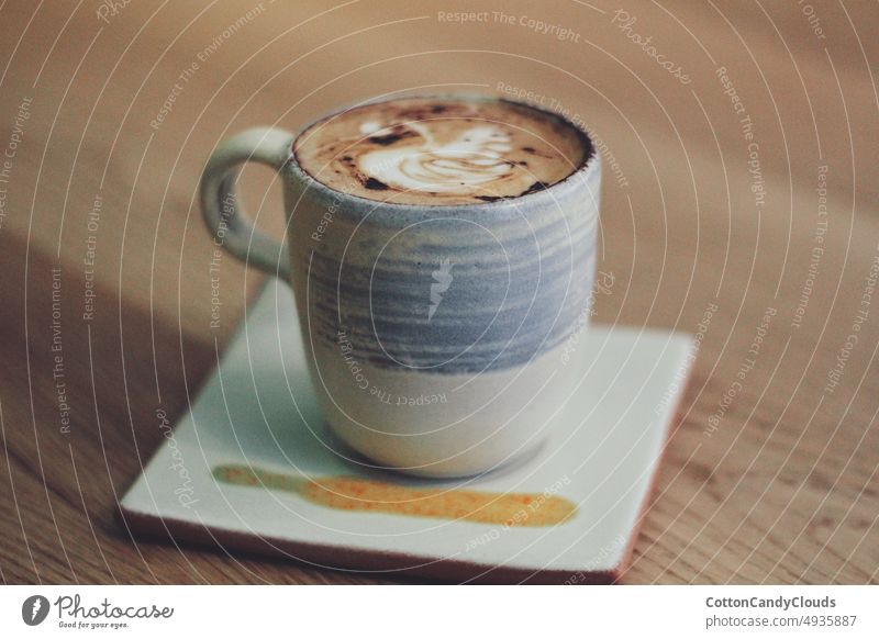 3 year old boy drinking mug of hot chocolate in a cafe Stock Photo - Alamy