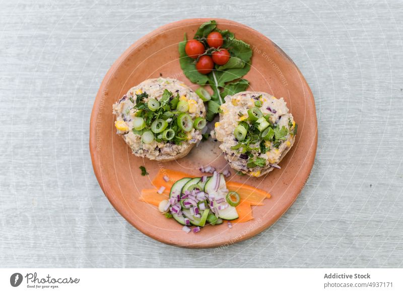 Plate with vegetarian sandwiches and vegetables on table food lunch pate mushroom serve plate wooden delicious tasty meal palatable delectable cuisine culinary