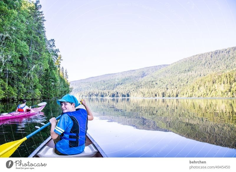 read stories Paddling Child Son Infancy Exterior shot Nature British Columbia Idyll Adventure North America Freedom mountain lake Wanderlust Landscape Lake