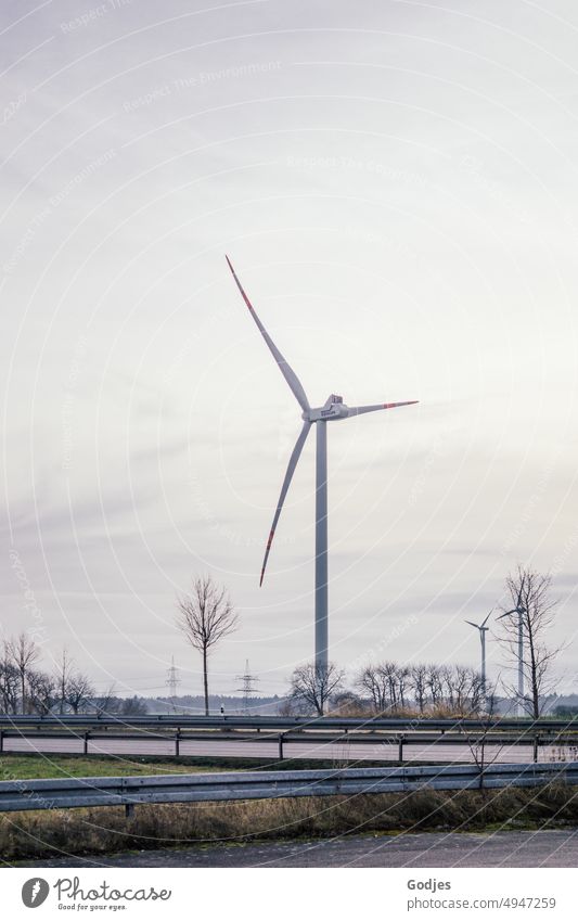 Wind turbine on a main road wind power Wind energy plant Energy Sky Renewable energy Energy industry Electricity Environment Pinwheel Sustainability Main street