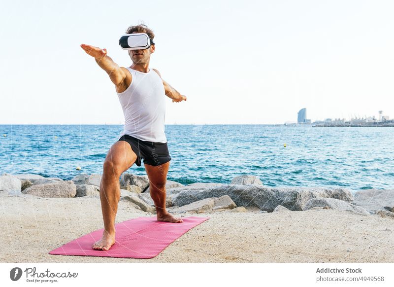 Group of women doing yoga in Reverse Warrior pose - a Royalty Free