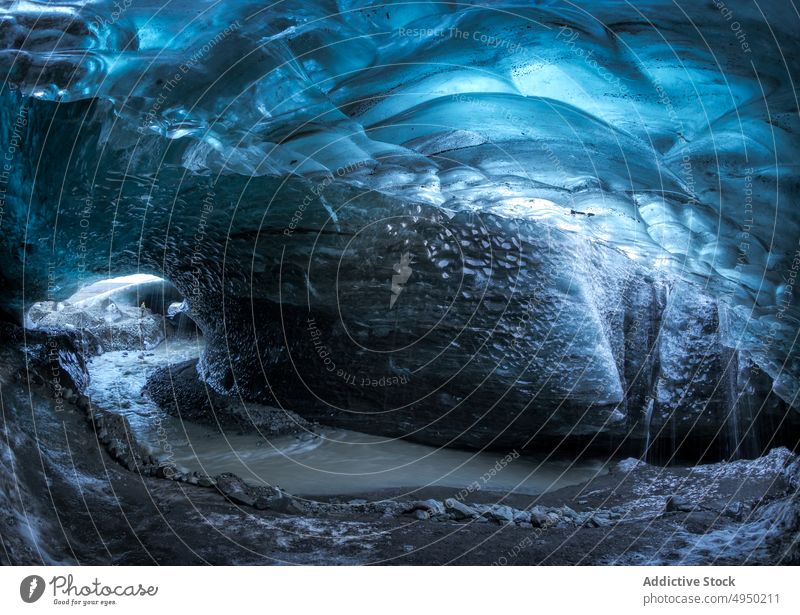 Blue ice cave in winter rough formation cold blue frozen water nature skaftafell iceland crystal brook freeze wall snow frost weather climate north season