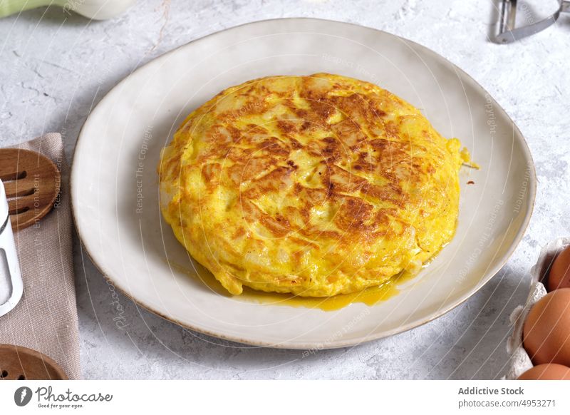 Tasty omelet served on table in kitchen omelette egg spanish food dish tradition spanish cuisine meal delicious onion salt oil ingredient domestic homemade