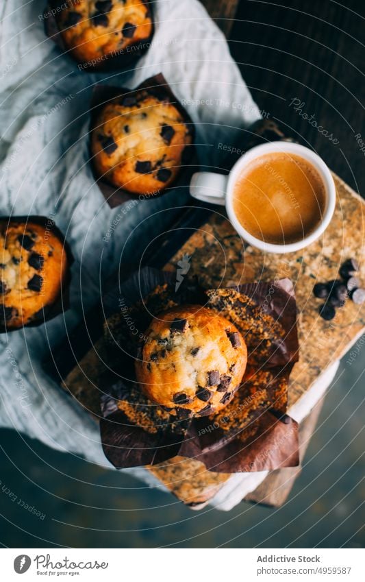 Chocolate muffins and coffee cup on dark background baked breakfast butter cake chocolate cupcake dessert food sweet wooden fresh delicious tasty yummy calories