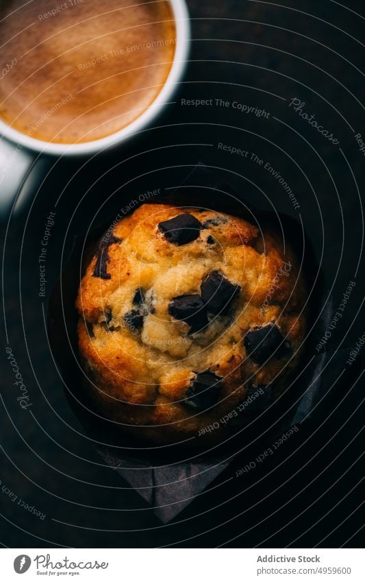 Chocolate muffins and coffee cup on dark background baked breakfast butter cake chocolate cupcake dessert food sweet fresh delicious tasty yummy calories snack