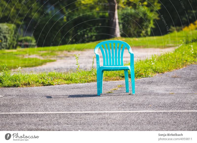 Lonely turquoise garden chair on the roadside in the green XD - a Royalty  Free Stock Photo from Photocase