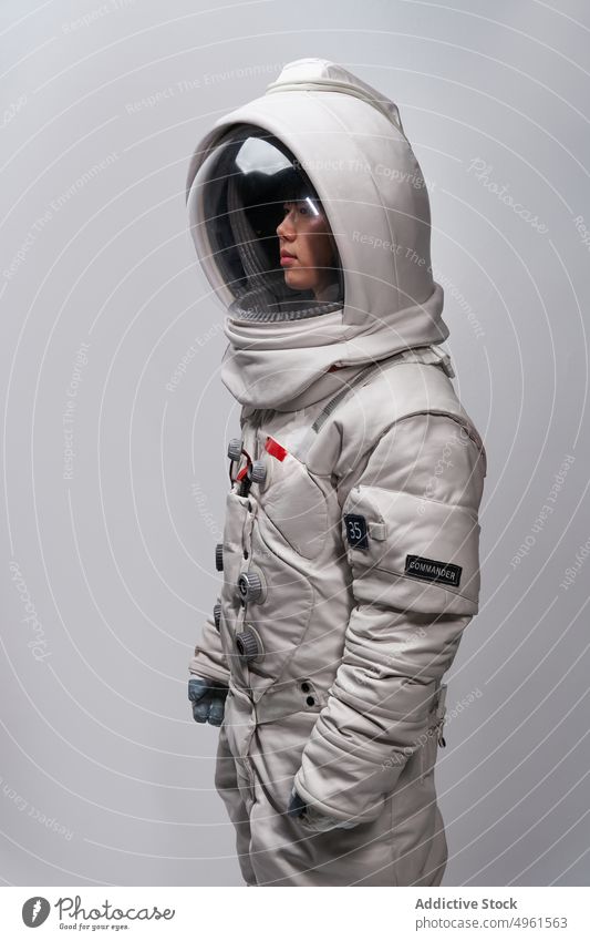 Female cosmonaut in futuristic spacesuit woman astronaut mission costume helmet brave cosmos protect female young asian chinese japanese safety future
