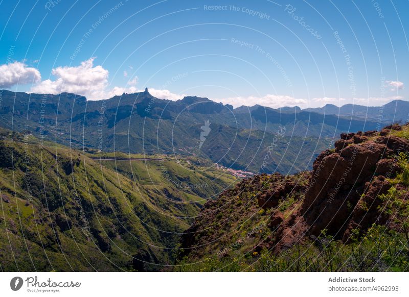 Rocky mountains under blue sky in summer range road landscape rocky highland scenery ridge terrain nature majestic green tranquil scenic breathtaking cloud