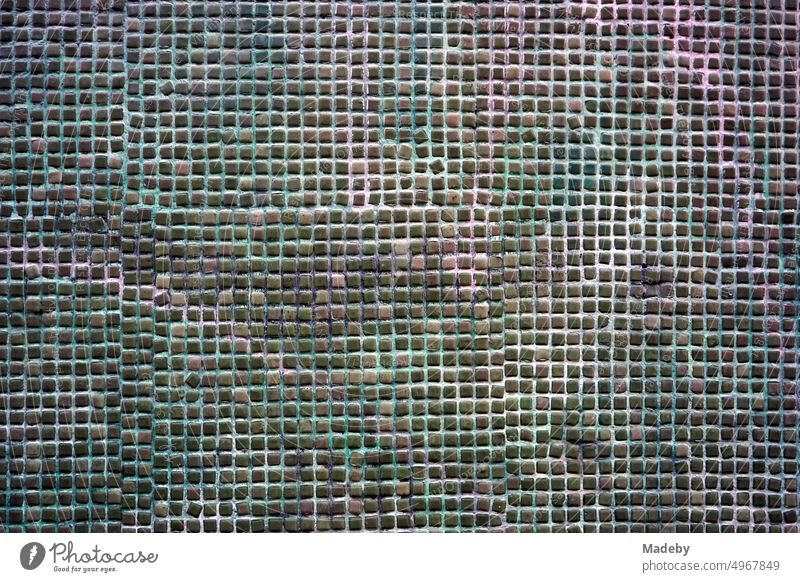 Fine mesh old lattice in green and natural colors in the facade of an old building in the Galata quarter in the Beyoglu district of Istanbul on the Bosporus in Turkey