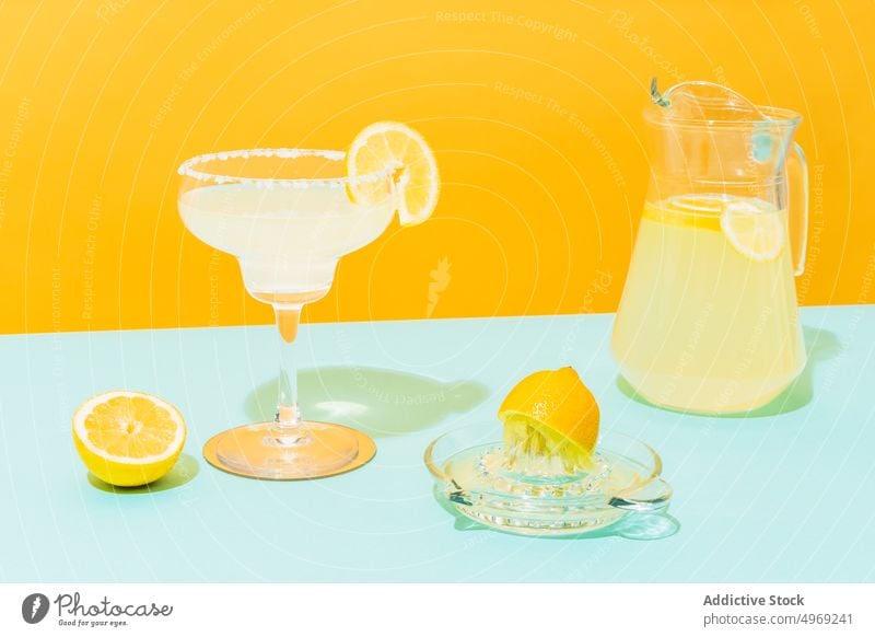 Fresh lemonade on colorful background fresh drink bright jug glass citrus beverage cool cold mexican tradition fruit refreshment juice slice vitamin healthy