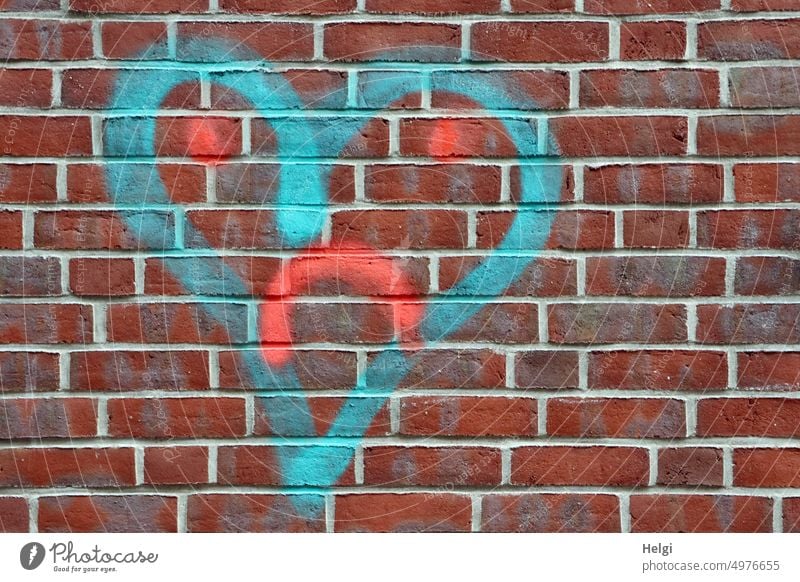 heartbreak? - a turquoise spray painted heart with sad face on a red brick wall Heart Love Lovesickness Face Sprayed Colour colored Wall (building)