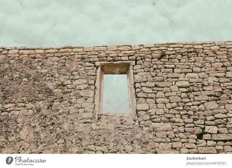 Unplastered wall of a ruin with window cavity and view to the sky Wall (barrier) Ruin Window Window cavity Vista see through Sky stones stone house Old