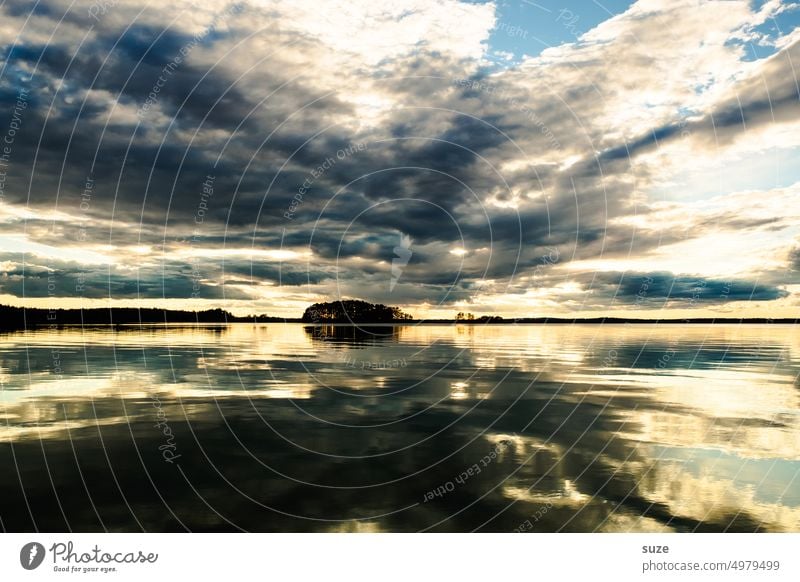 Picture with horizon Lake Swede Clouds Sunset Water Sky Blue Nature Evening Reflection Exterior shot Lakeside Colour photo Light Sunlight Landscape Idyll