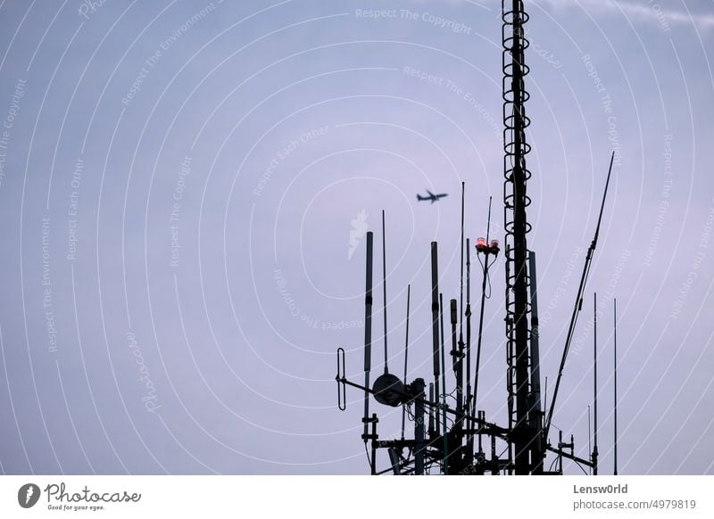 Telecommunication antenna against the evening sky blue broadcast broadcasting cell cellular equipment frequency industrial industry metal mobile network phone
