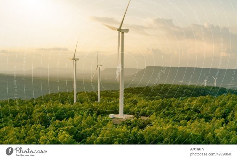 Wind energy. Wind power. Sustainable, renewable energy. Wind turbines generate electricity. Windmill farm on mountain with sunset sky. Green technology. Renewable resource. Sustainable development.