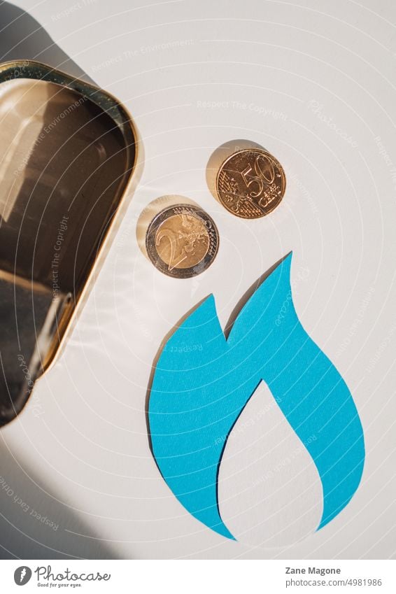 Natural gas symbol with coins and empty tin can natural gas gas consumption gas money saving natural resources gas economy saving gas saving resources debt