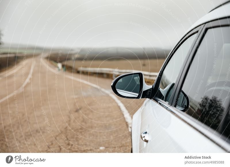 Outside mirror of car on the road trip motion moving view highway auto drive automobile race outdoors driver horizontal outside curve traffic transportation