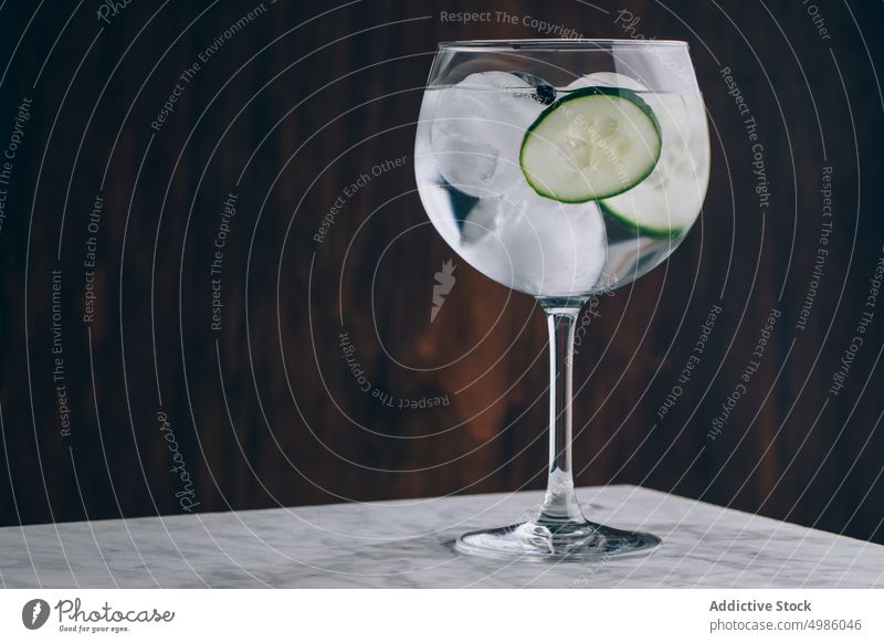 Gin tonic with cucumber and ice cocktail gin cold drink refresh alcohol glass beverage refreshment booze slice aperitif tasty party liquid serve cool pub