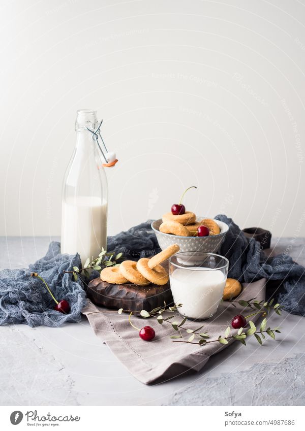 Rustic still life with milk and cookies glass table background breakfast food fresh dairy drink healthy natural nutrition summer wooden beverage calcium closeup