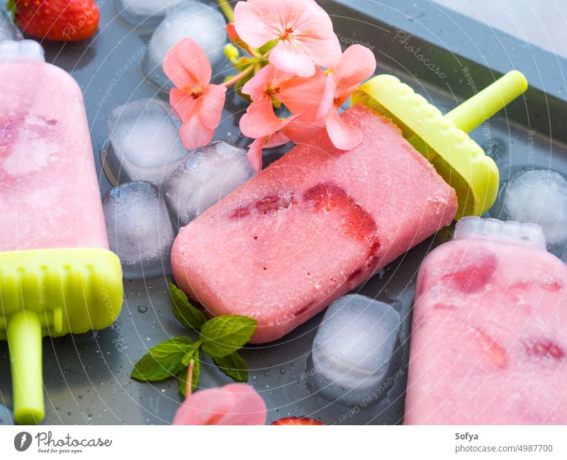 Home made strawberry ice cream popsicles dessert food sweet fruit pink closeup fresh home made frozen summer background gray tray cube cold dairy gourmet