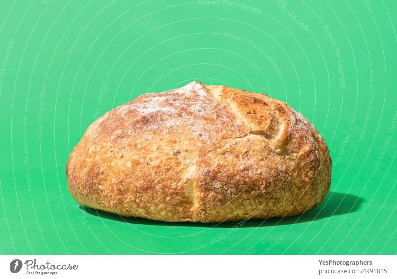 White bread on a green background, close-up above artisan baked bakery bright brown carbs color crust cuisine delicious food fresh golden gourmet healthy