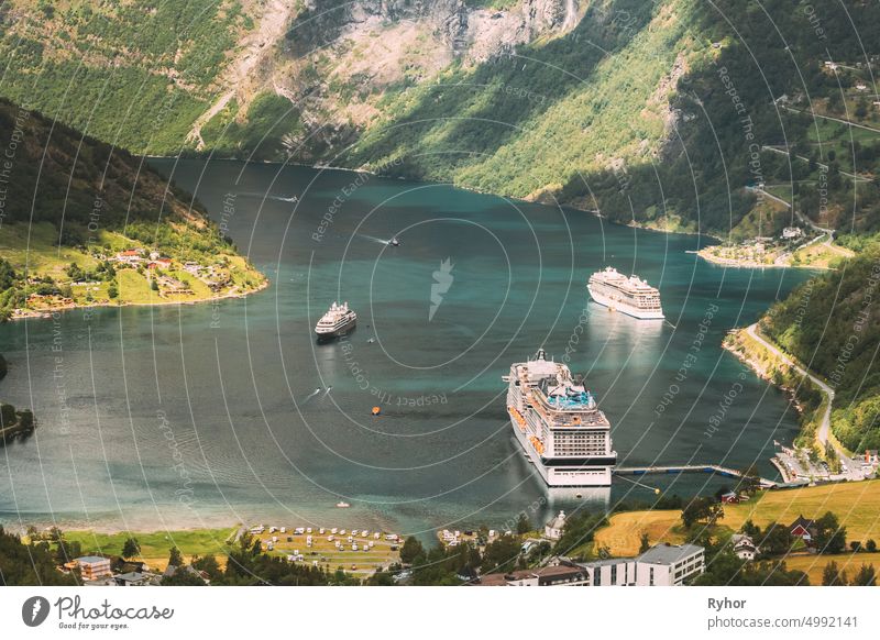 Geirangerfjord, Norway. Aerial View Of Geiranger In Geirangerfjorden In Summer Day. Touristic Ship Ferry Boat Liner Moored Near Geiranger. Famous Norwegian Landmark And Popular Destination