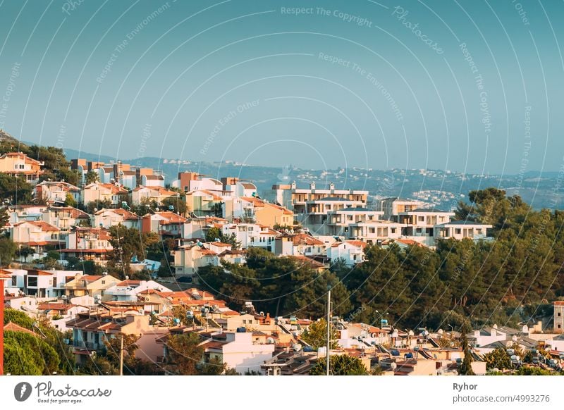 Kusadasi, Turkey. Beautiful Cityscape Of Turkish Town. White Residential Houses On Hillside. Real Estate Suburb In Summer Evening apartment architecture