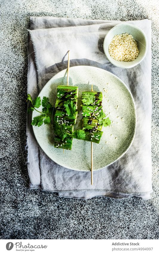 BBQ slices of okra with sesame seeds Turkey background bamia bamya barbecue barbeque bbq bowl concrete cook coriander cuisine cut diet food greece green grey