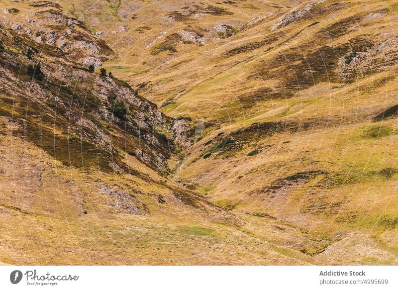 Scenic mountainous valley under cloudy blue sky in Catalonia landscape nature highland range picturesque scenery slope ridge scenic rocky peak val d aran