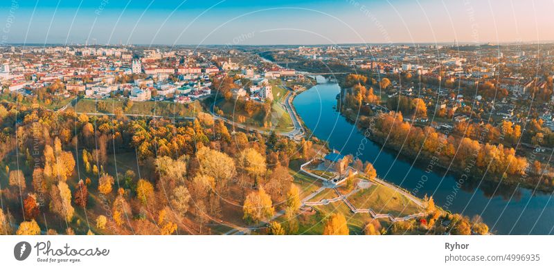 Grodno, Belarus. Aerial Bird's-eye View Of Hrodna Cityscape Skyline. Famous Popular Historic Landmarks In Sunny Autumn Evening. Panorama in Sunset Lights