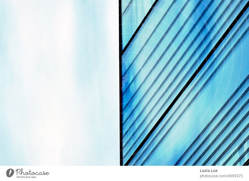 Glass facade against blue sky Pane Glas facade Blue Direct Stripe urban Sky Sky blue Light Architecture Modern Facade Reflection Building Modern architecture