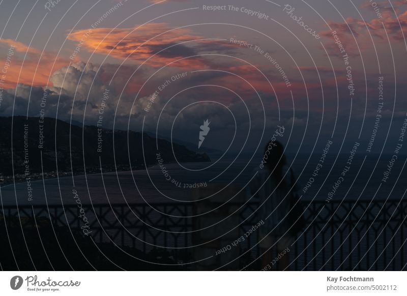 dramatic evening sky over bay around taormina, italy bay of water cloud cloud - sky cloudscape coast coastline dramatic sky fence horizon horizontal idyllic