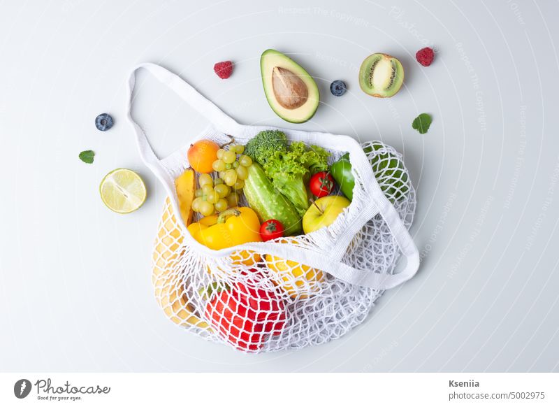 Fresh fruits and vegetables in shopper on grey background. Healthy eating and zero waste concept. Flat lay. breakfast cooking culinary detox diet eco food fresh